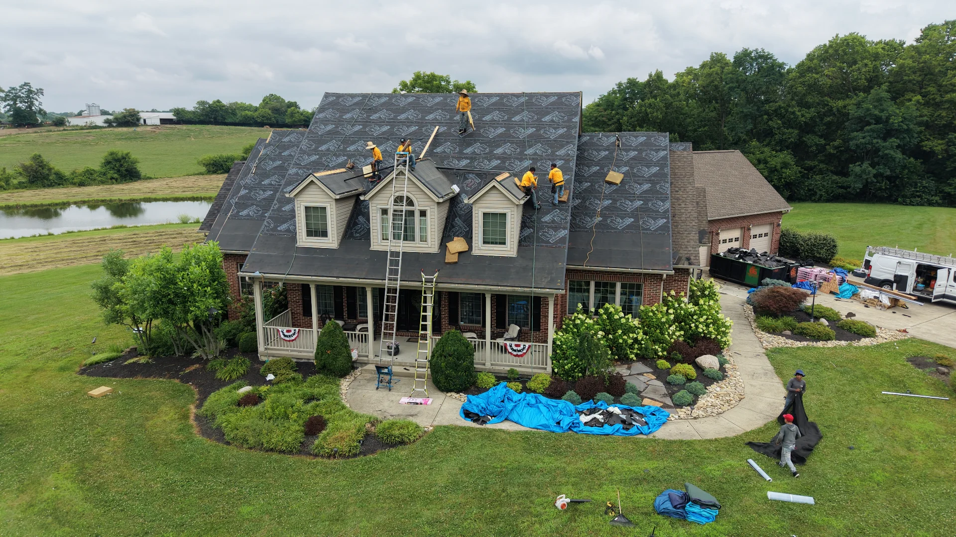 Aerial view of the Rooftop Relief crew installing a new shingle roof on a Cincinnati home