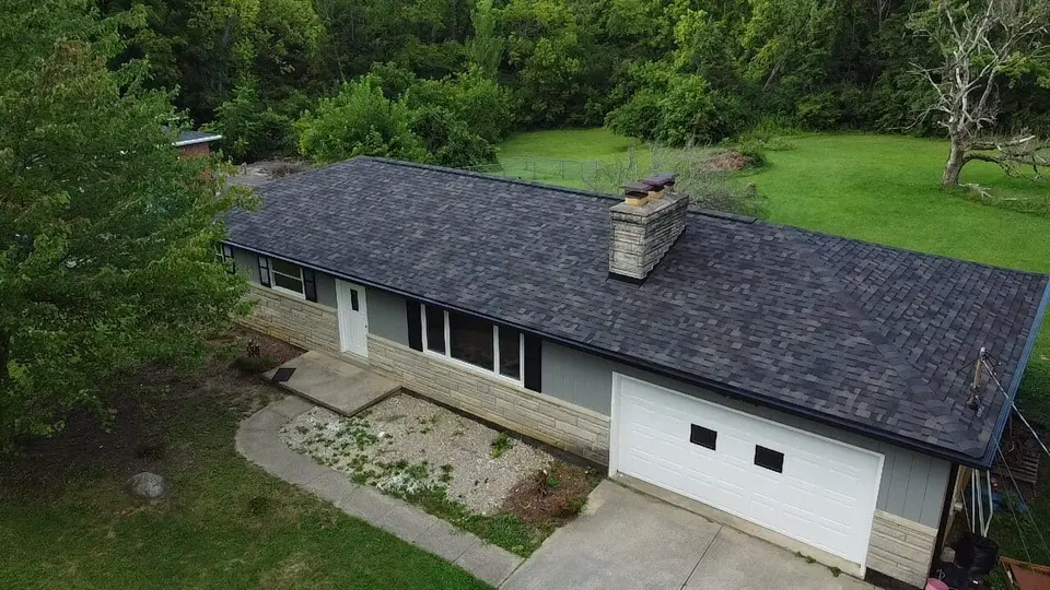 The same Mason ranch home after its roof replacement