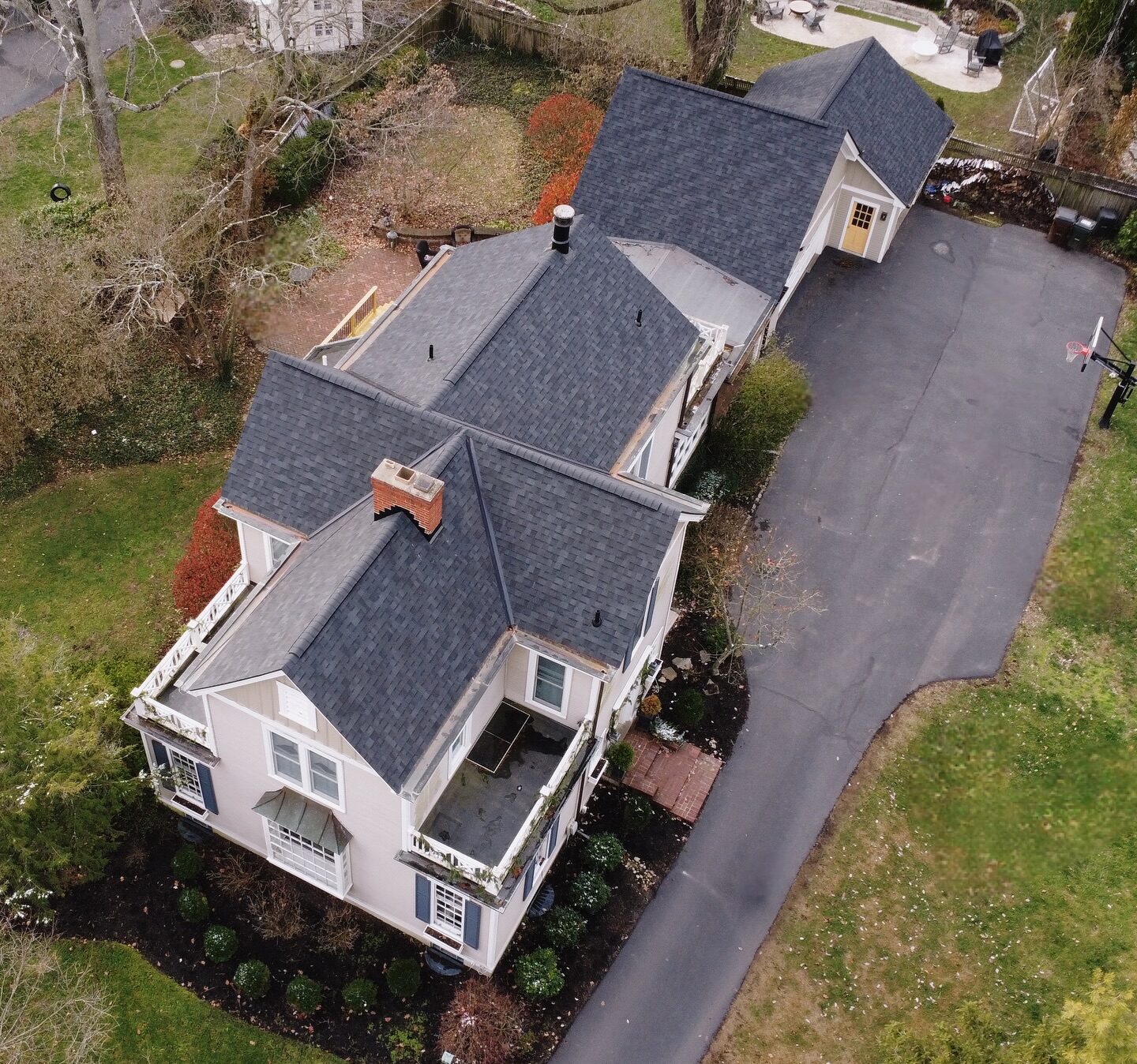 Aerial view of a completed shingle roof replacement on a historic home in Milford, OH
