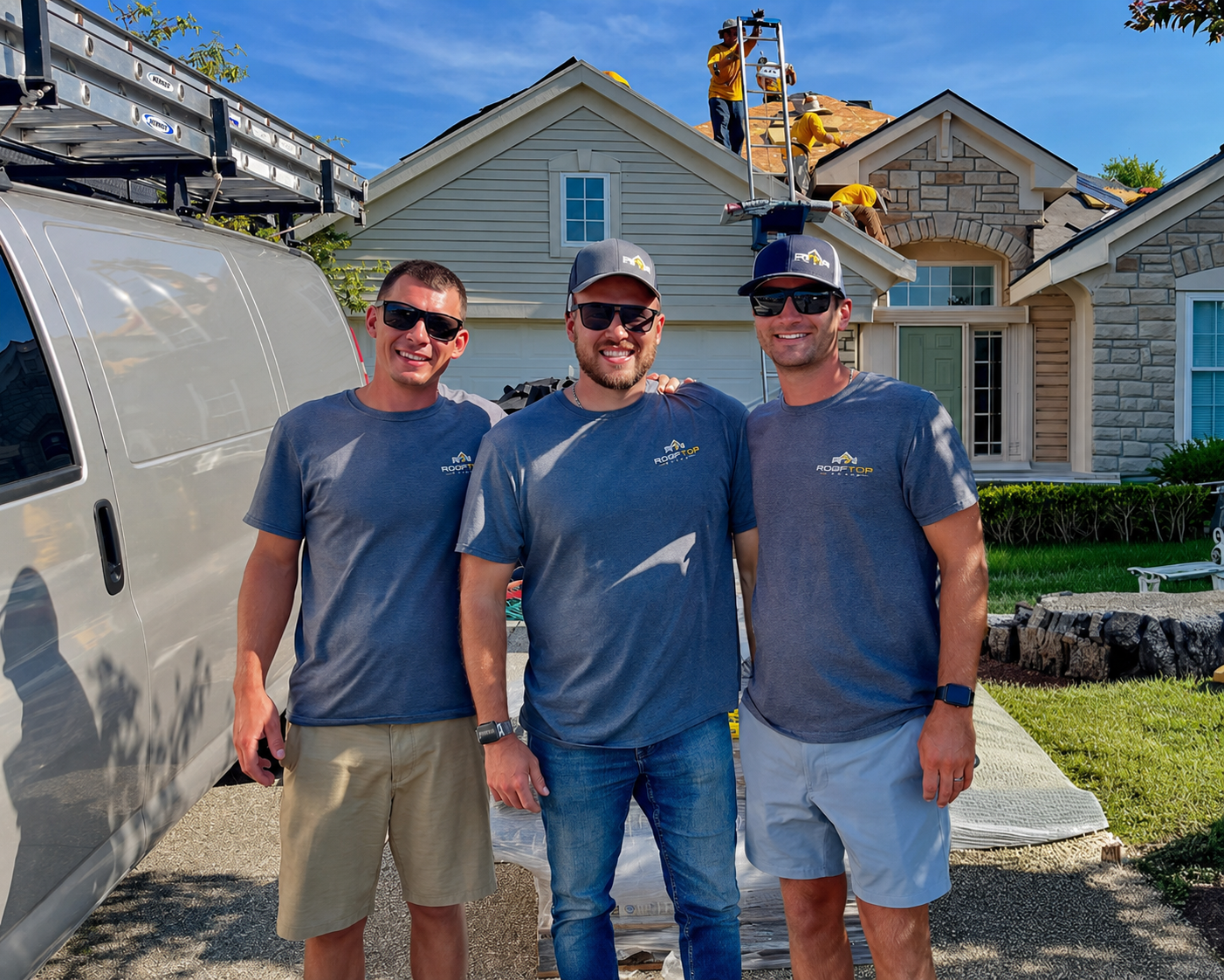 The Rooftop Relief crew in front of a Cincinnati home with their service van and a roofing project underway